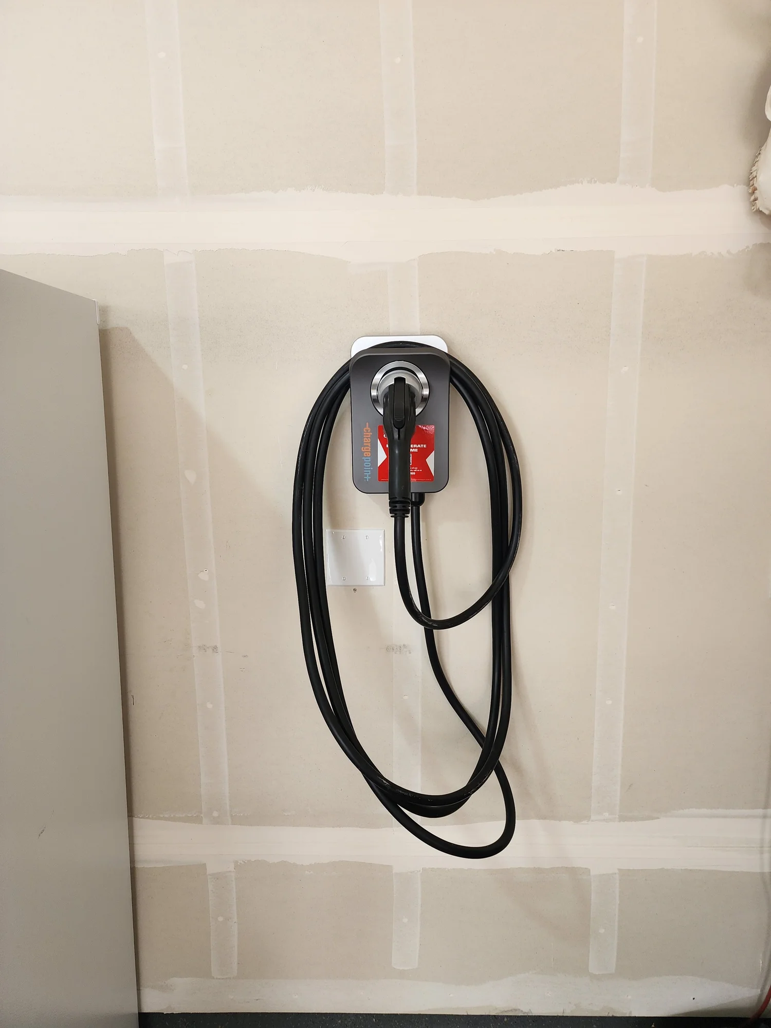 EV charger installed by NW Electric in a residential garage
