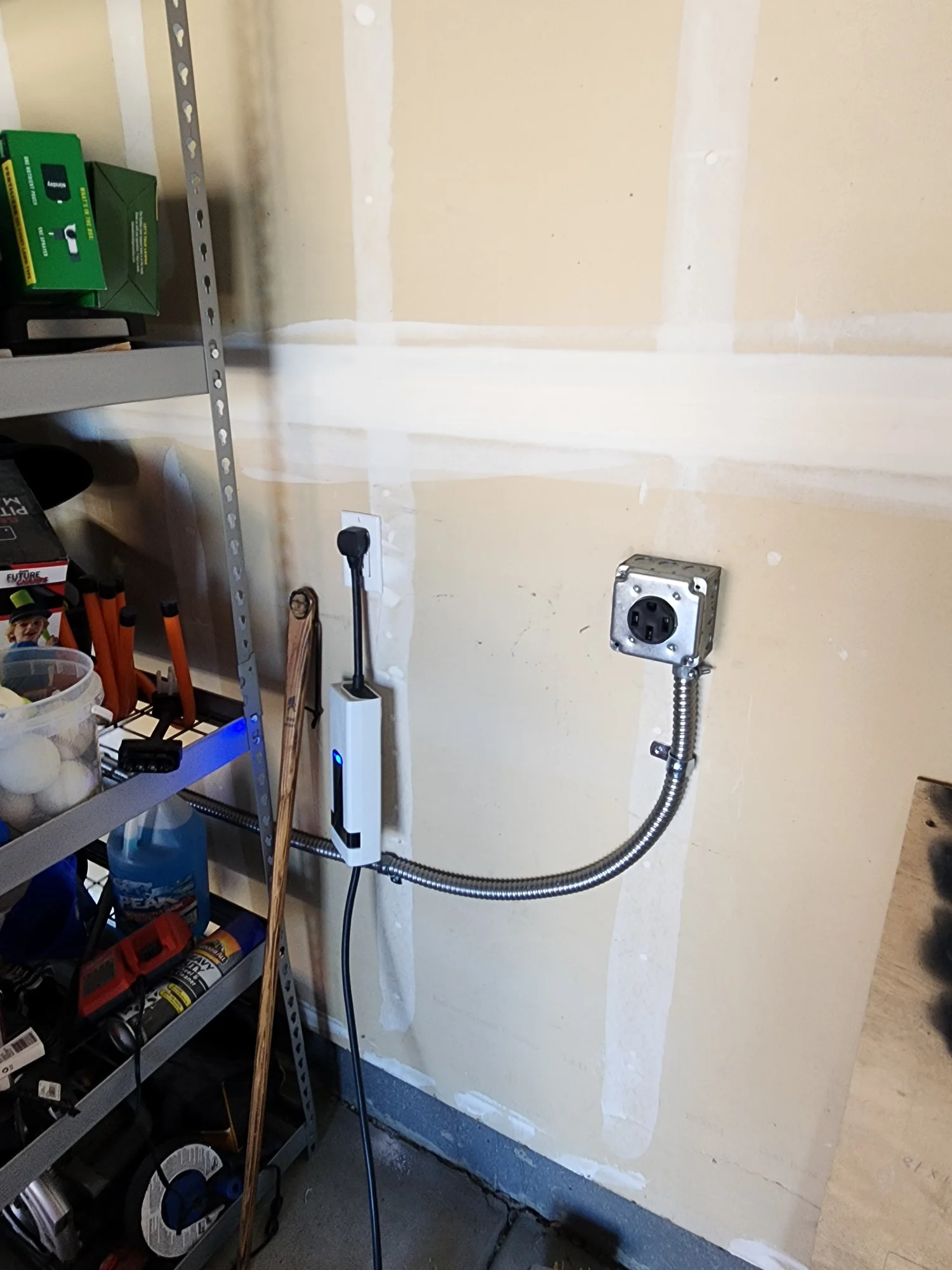 Clean electrical conduit and device installation in a garage